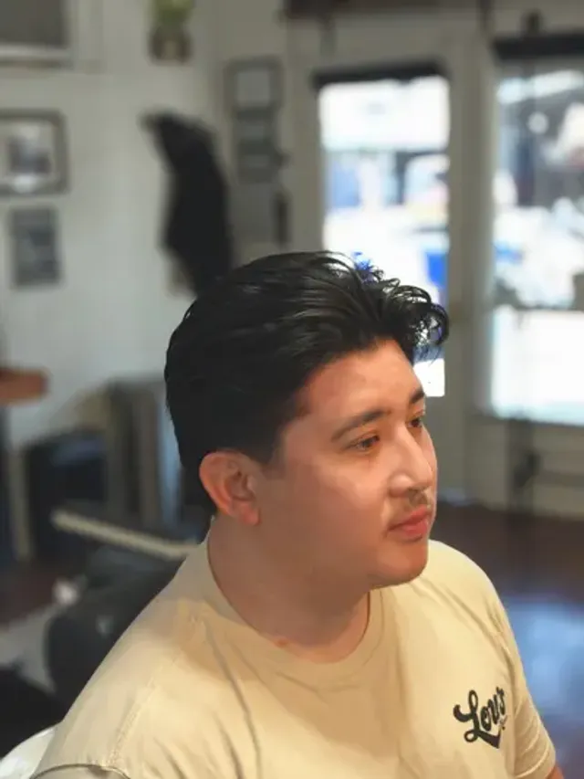 Middle part haircut at Richmond Barbershop